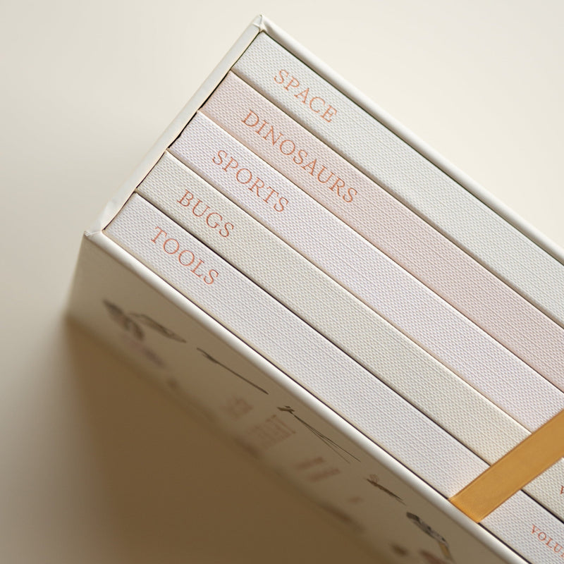 Stack of books with text on a beige background