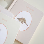 Board book with dinosaur illustration on a light background