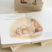 Children's book with fox illustration on a light surface