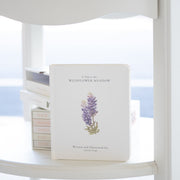 Book with floral design on a white surface