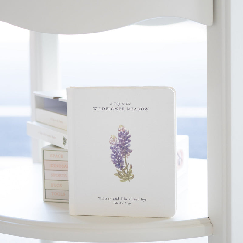 Book with floral design on a white surface