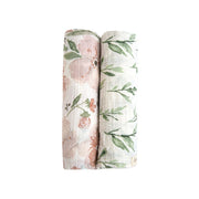 Two rolled Parker floral muslin swaddle blankets in coordinating prints