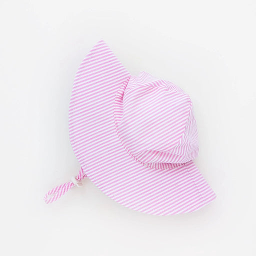 Pink striped baby hat on a light gray background