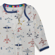 Children's long-sleeve sleeper with airplane pattern on a white background