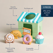 Itzy Play Bakery activity toy shown with included soft squeezy bakery-themed play pieces