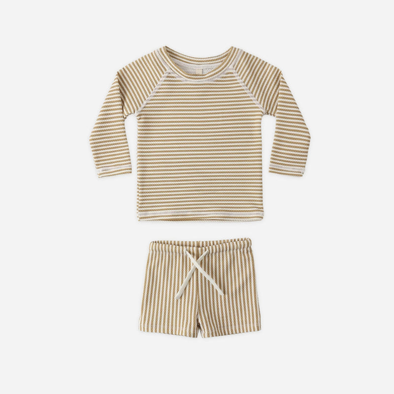 Striped long-sleeve shirt and shorts set on a white background