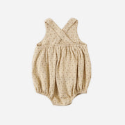 Baby romper with cross-back design on a white background