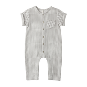 Checkered baby romper with buttons on a white background