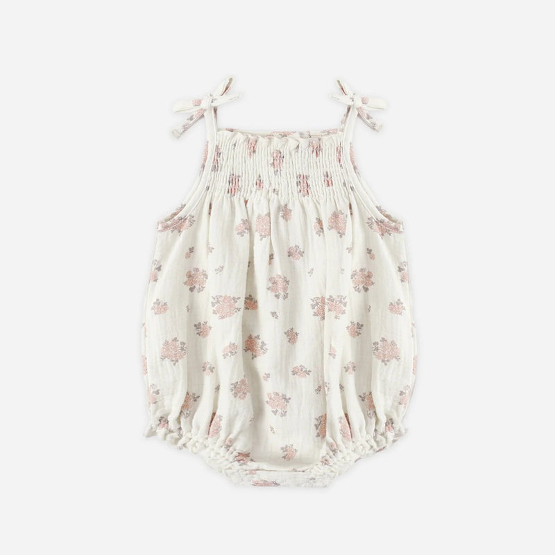 Floral baby romper on a white background
