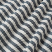 Close-up of a fabric with blue and white wavy pattern