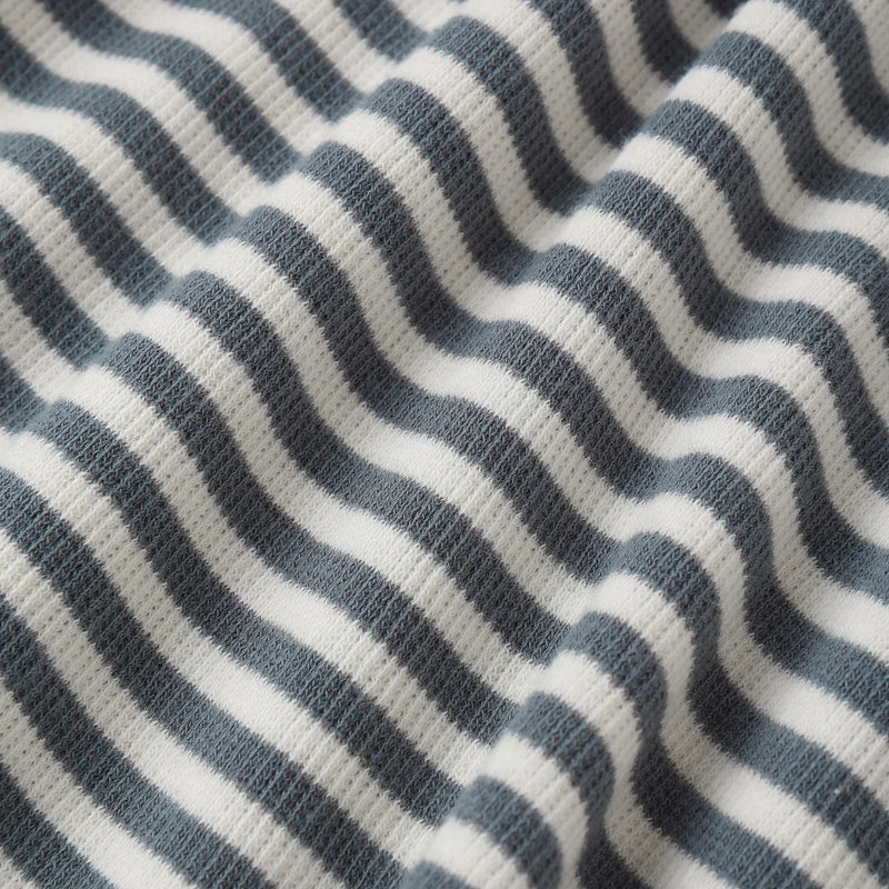 Close-up of a fabric with blue and white wavy pattern