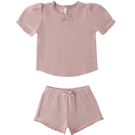 Pink ribbed top and shorts set on a white background