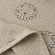 Beige fabric with embroidered lion designs