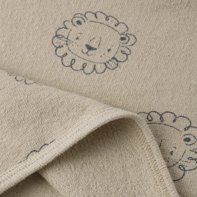 Beige fabric with embroidered lion designs