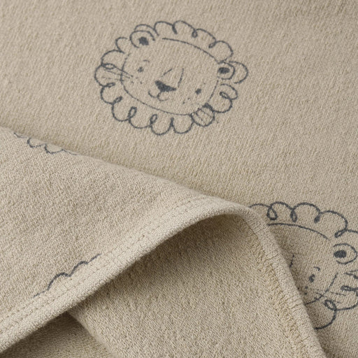 Beige fabric with embroidered lion designs