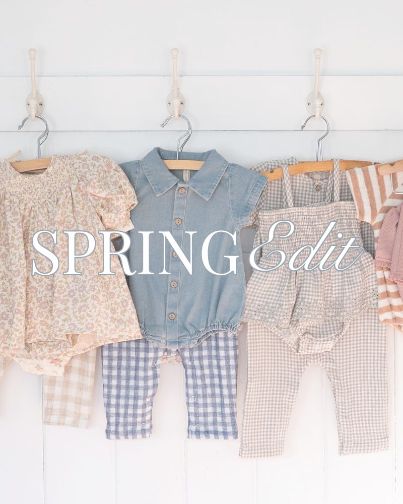 Children's clothing on hangers with 'Spring Edit' text