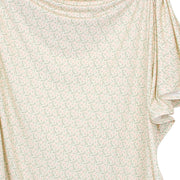Close-up of a floral-patterned fabric with a light background