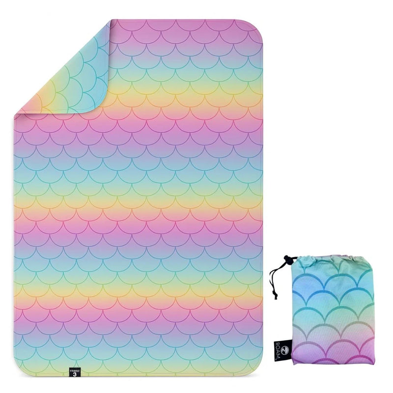 Colorful scalloped patterned blanket with matching pouch on a white background