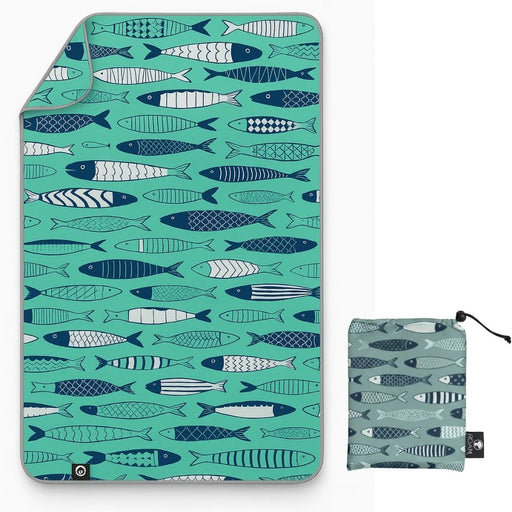 Teal blanket with fish pattern and matching pouch on a white background
