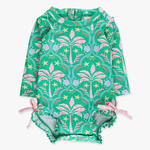 Green children's swimsuit with palm tree pattern on a white background