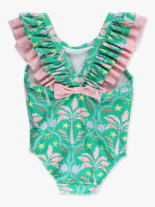 Green and pink patterned swimsuit with ruffled straps on a white background