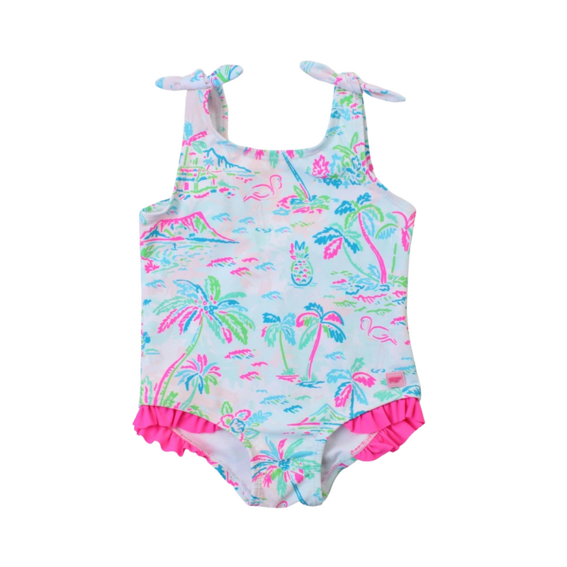 A girl's one-piece swimsuit with tie shoulder straps featuring a tropical resort print with palm trees and a pink ruffle at the bottom.