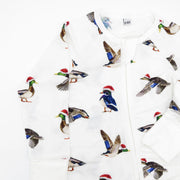 Close-up of Duck The Halls holiday print showing hand-painted ducks in Santa hats on soft bamboo white fabric