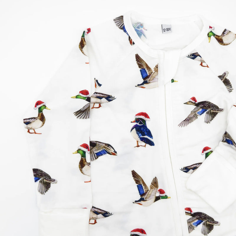 Close-up of Duck The Halls holiday print showing hand-painted ducks in Santa hats on soft bamboo white fabric