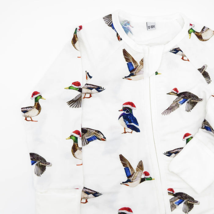 Close-up of Duck The Halls holiday print showing hand-painted ducks in Santa hats on soft bamboo white fabric