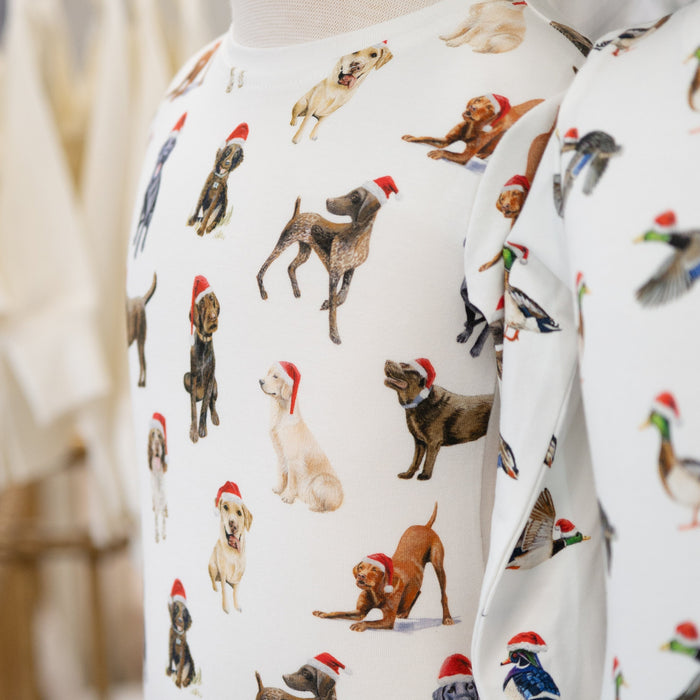 White child pajama top with hunting dog wearing santa hat pattern on a mannequin