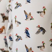 White shirt with colorful duck pattern on a white background