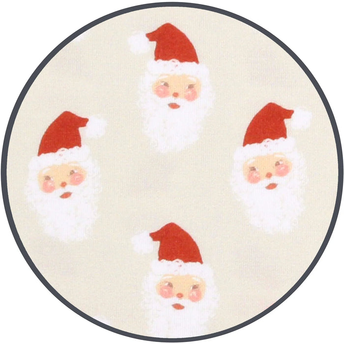 Closeup of details - Santa Claus faces on a beige background