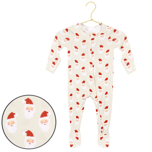 A baby footed sleeper in cream with a repeating Santa Claus face print, hanging on a gold hanger against a white background, with a circular inset showing a close-up of the print.