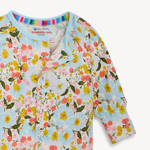 Floral-patterned baby cardigan with colorful trim on a light blue background