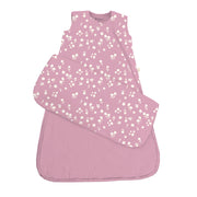 A pink Mini Floral Sleep Sack Swaddle is laid flat with one swaddle wing folded outward to show the design and shape.