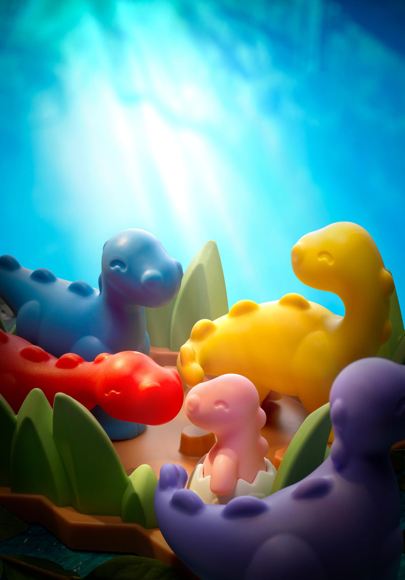 SmartGames Tiptoe Dino dinosaurs in an illustrated scene