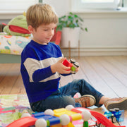Boy building a SmartMax magnetic stunt car