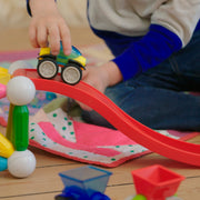 SmartMax magnetic car racing down a red ramp