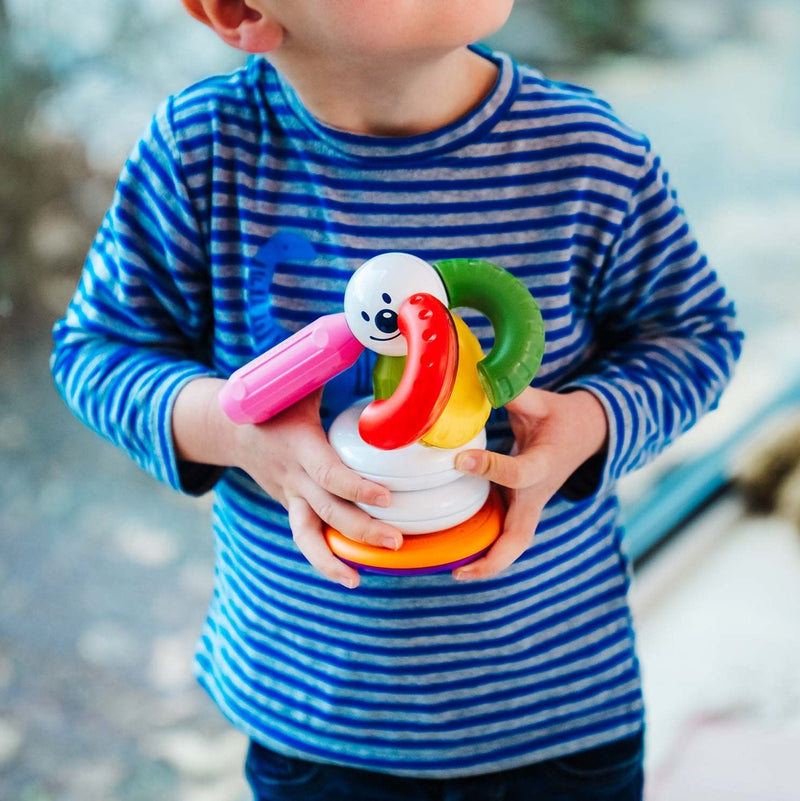 Toddler holding a SmartMax My First Stacking Rings magnetic figure