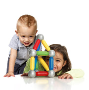 Two children playing with a colorful toy structure on a white background