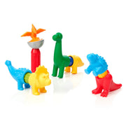 Set of colorful dinosaur-shaped sand toys on a white background