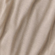 Close-up of beige fabric with folds