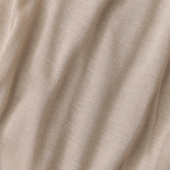 Close-up of beige fabric with folds