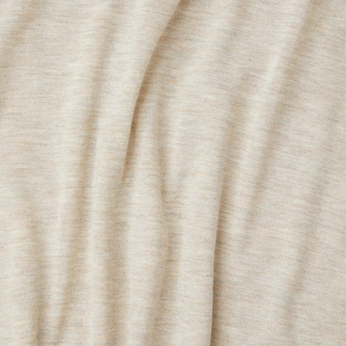 Close-up of beige fabric with folds