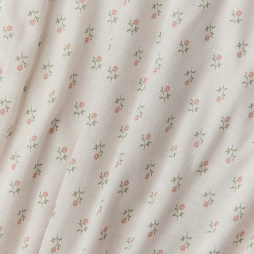 Floral patterned fabric with small flowers on a light background