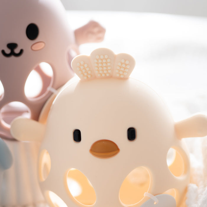 yellow baby chick teether on a light background.