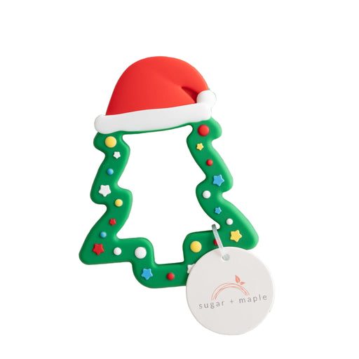 Christmas-themed teether with a Santa hat on a textured white background