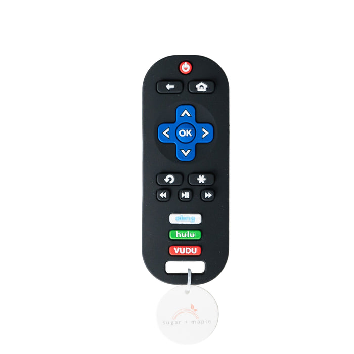 Black remote control teether with blue buttons on a white background