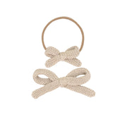 Knitted bow hair accessories on a white background