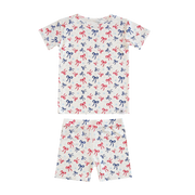 Children's pajama set with bow pattern on a white background